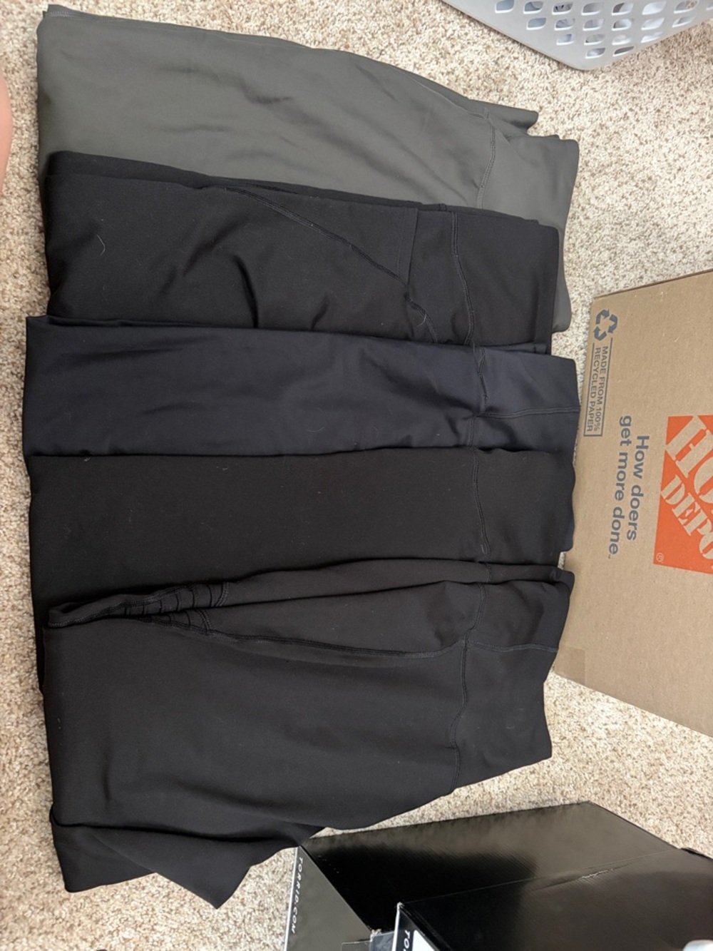 Stack of Black and Olive Pants